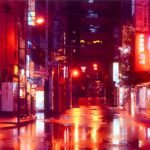 Vibrant Tokyo street scene at night with neon lights and wet pavement reflections.